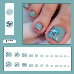 Foggy green butterfly press-on toenails with silver glitter and pearl accents