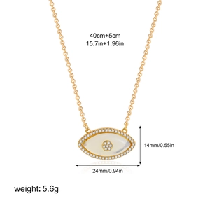 Detailed view of 18K gold plated evil eye pendant with white zircon and mother of pearl