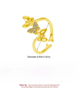 Detail view of adjustable gold butterfly ring with cubic zirconia inlays and dimensions