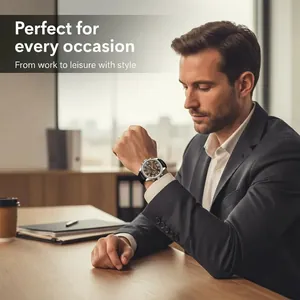 Classic silver business watch with black leather strap worn by man in a dark suit