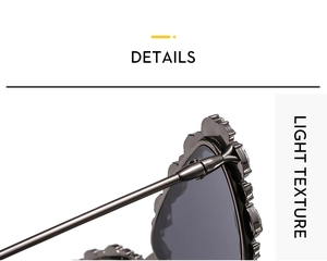 Detailed macro view of gunmetal butterfly frame with ornate wavy texture and crystals