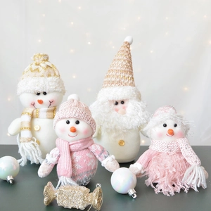 Plush Christmas dolls featuring Snowman and Santa in warm white pink and gold tones