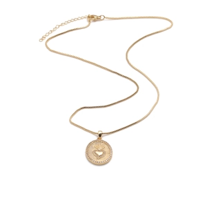 Detail of gold heart pendant with crown design and cubic zirconia on box chain