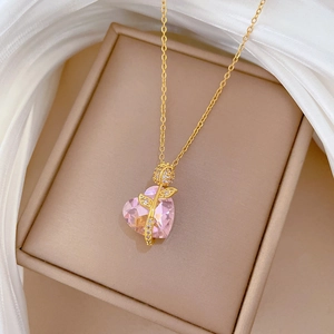 Pink heart crystal necklace with golden rose pendant and sparkling zircon accents