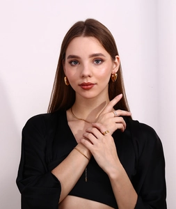 Polished 18K gold plated jewelry set featuring heart earrings and a sleek snake chain