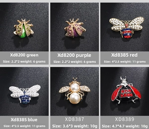 Detail view of insect brooches with rhinestones and pearls including size and weight specs