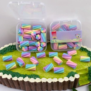Detail of colorful marshmallow shaped erasers in a transparent box for students