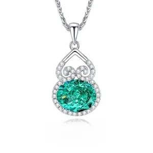 Macro detail of S925 silver gourd pendant featuring emerald green stone and fine diamonds