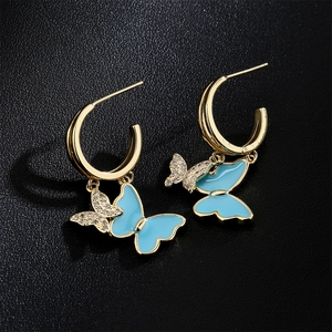 Elegant 18K gold-plated butterfly earrings with blue enamel and sparkling rhinestones