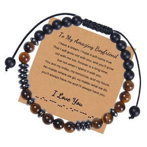 Detail of tiger eye and matte onyx beads on Morse code bracelet with gift card