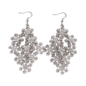 Sparkling silver snowflake drop earrings with crystal rhinestones on a white background