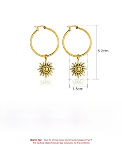 Macro detail of gold sun pendant earrings with size measurements and alloy specs