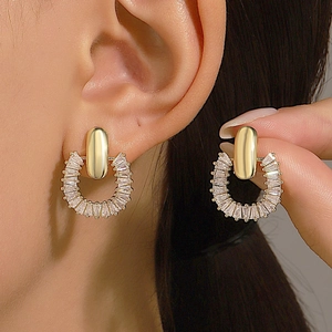 French luxury gold half-hoop earrings with sparkling baguette-cut cubic zirconia crystals