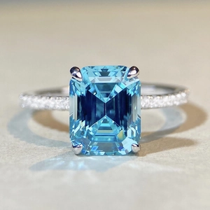 Elegant 925 sterling silver ring with emerald cut aquamarine and pavé set diamonds