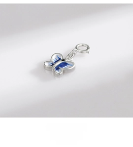 Detail of 925 sterling silver butterfly pendant with blue enamel and spring clasp