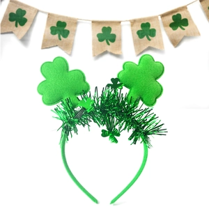 Close-up of St. Patrick's Day headband featuring green tinsel and shamrock felt decorations