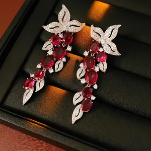 Elegant zircon flower tassel earrings with red ruby stones and silver leaf design