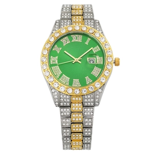 Luxury iced-out women's watch with emerald green dial, date window, and crystal accents