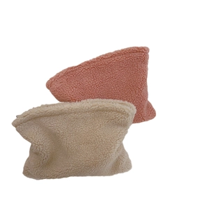 Soft lamb wool cosmetic bags in pink and beige, textured winter storage pouches