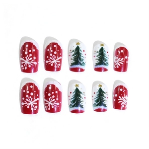 Christmas press-on nails with red snowflake and white Xmas tree patterns in medium length