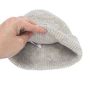 Grey ribbed knit beanie hat for winter with warm elastic texture and inner care label