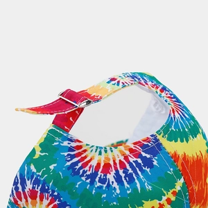 Detail of adjustable silver metal buckle on tie-dye rainbow cotton baseball cap