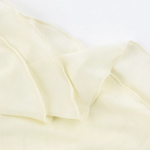 Close-up of the delicate off-white mesh fabric showing fine breathable texture and soft folds