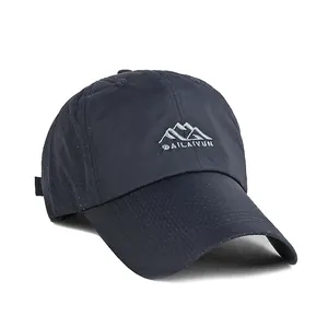 Quick-dry navy blue baseball cap with laser-cut holes and embroidered mountain logo