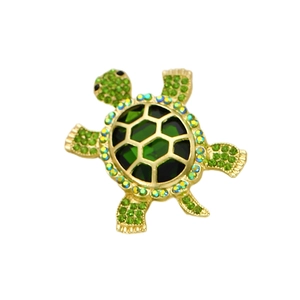 Broche tortue vintage dorée sertie de cristaux verts et d'une grande gemme