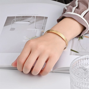 Luxurious gold stainless steel open bangle with textured honeycomb finish for women