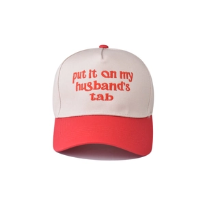 Detail of red and cream cotton baseball cap featuring high-quality vintage embroidery text