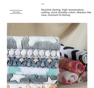 Detailed texture showing soft coral fleece pet blankets with cute paw and star prints
