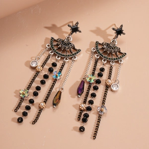 Boucles d'oreilles fleurs géométriques vintage avec strass noirs et longs pompons