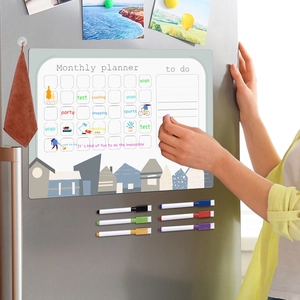 Magnetic monthly planner on fridge with six colorful markers and scheduled to-do list