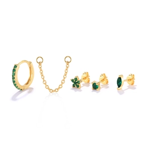 Detail showing 5-piece gold earring set with emerald green gems and chain link