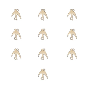 Detailed view of ten golden penguin alloy pendants for jewelry and DIY craft making