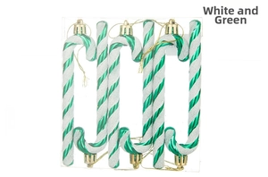 Detailed view of six white and green candy cane ornaments with glitter in a clear box