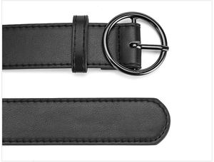 Detailed close-up of a premium black PU leather belt featuring a classic round pin buckle