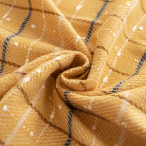 Maillard plaid scarf in cream yellow with fringe, showcasing thick wool-like texture
