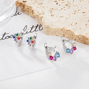 Detailed macro view of S925 sterling silver earrings with colorful star and floral zircon stones
