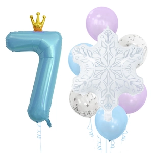 Blue number 7 balloon with golden crown and snowflake foil decorations for birthday party