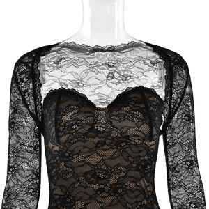 Detail shot of black lace long-sleeve top with heart-shaped lining and floral patterns