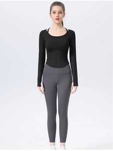 Slim fit black long sleeve yoga top and charcoal gray high-waist leggings for fitness