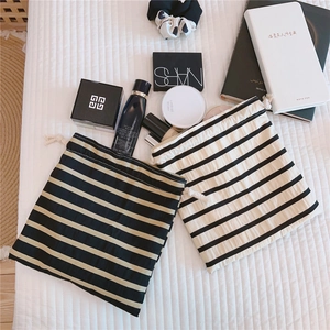 Detailed view of striped cotton drawstring pouches for jewelry and makeup storage