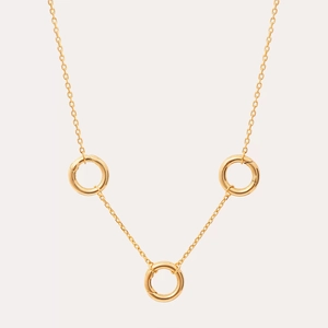 Close-up of three 18K gold plated stainless steel rings on a delicate DIY necklace chain