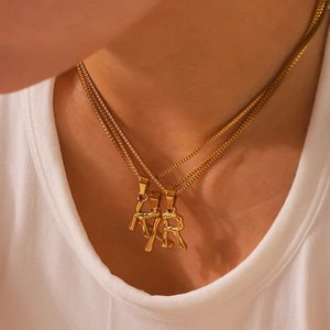 Close-up of 18k gold plated stainless steel box chain necklace with K Y R letter pendants