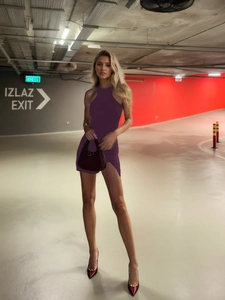 Slim fit purple halter neck mini dress with side slit and sleeveless backless design