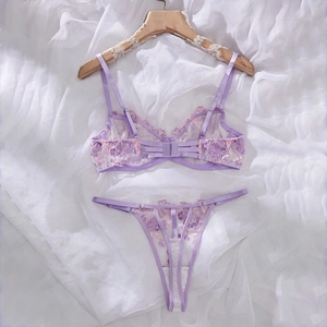 Detail of lavender sheer lace bra featuring intricate floral embroidery and steel underwire