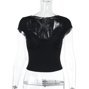 Detail of black slim fit lace patchwork top on mannequin with clear bust design