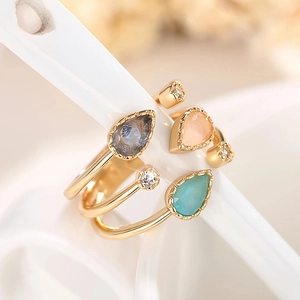 Elegant gold layered ring featuring three teardrop crystals and sparkling zircon accents